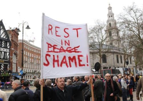 Protesters outside the Courts of Justice in the Strand prior to the funeral service of Baroness Thatcher