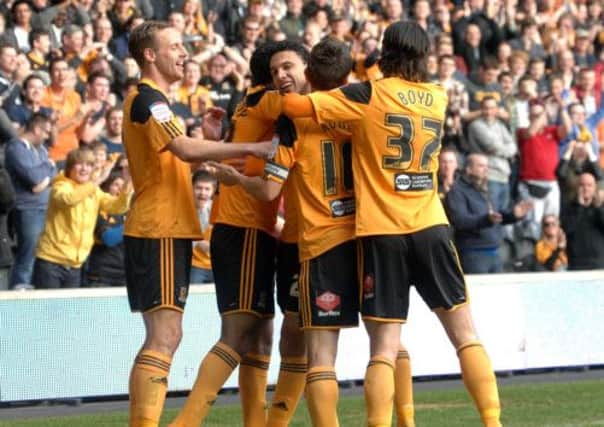 Hull City's Gedo, centre, celebrates scoring against Birmingham City