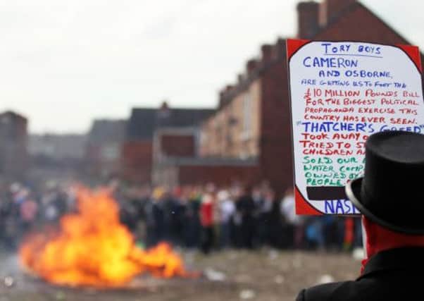 Protesters set fire to a coffin containing an effigy of Margaret Thatcher