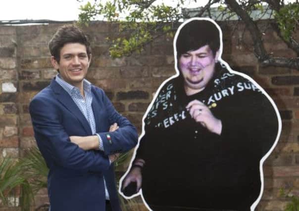 Matt Briggs next to a cardboard cut out of his former self.
