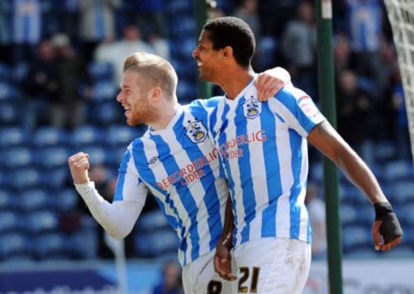 Jermaine Beckford celebrates his first goal with Adam Clayton.
