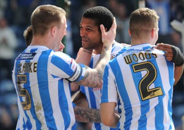 Huddersfield players celebrate Jermaine Beckford's first goal.