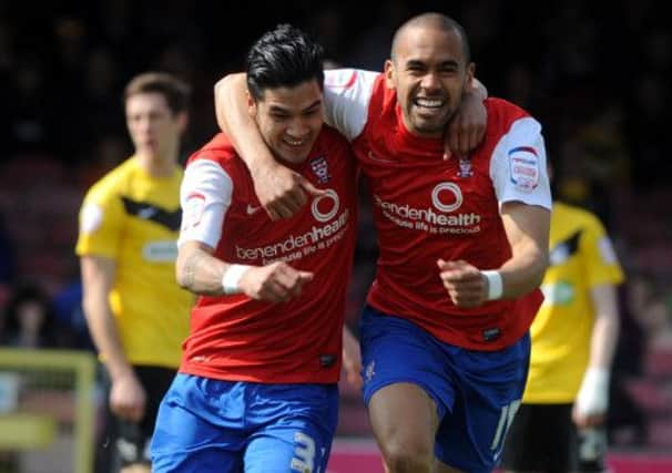 Adam Reed celebrates his goal with Ashley Chambers