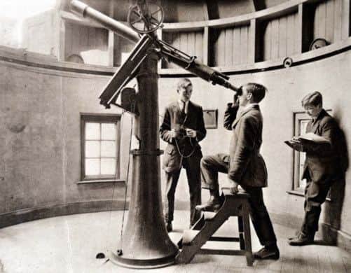 Edwardian students with the school's telescope.