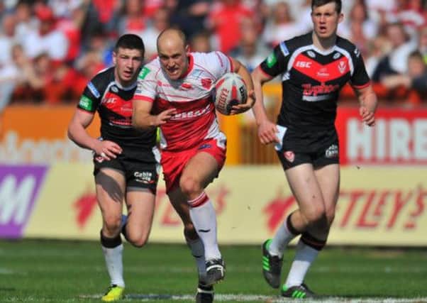 Michael Dobson makes a break for Hull KR in their win against St Helens. Rovers now face Wigan in the last 16.