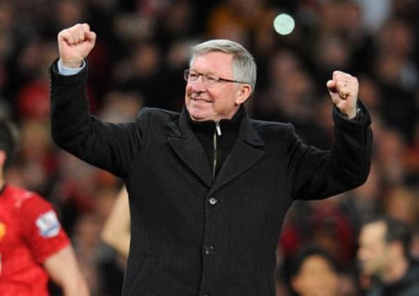 Manchester United manager Sir Alex Ferguson celebrates winning the league title after the final whistle