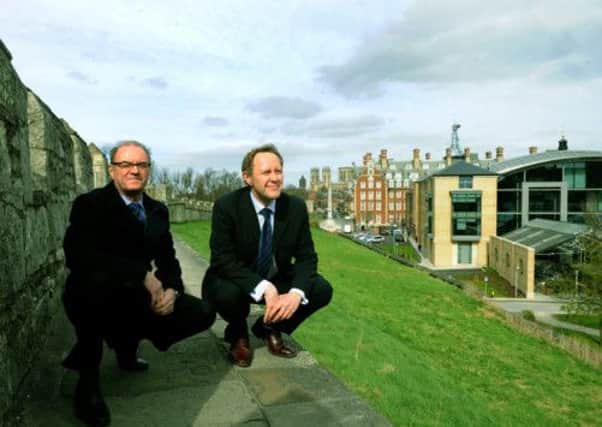 Chris Hale, Design Manager for S.Harrison Developments (left) with Trevor Mitchell, Yorkshire Planning and Conservation Director for English Heritage on the city walls in York past the new York Council buildings. Below: Norwood House in Beverley.
