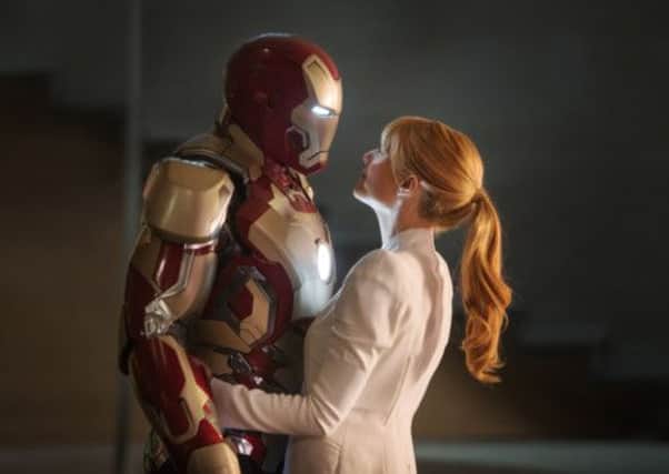 Robert Downey Jr as Iron Man and Gwyneth Paltrow as Pepper Potts