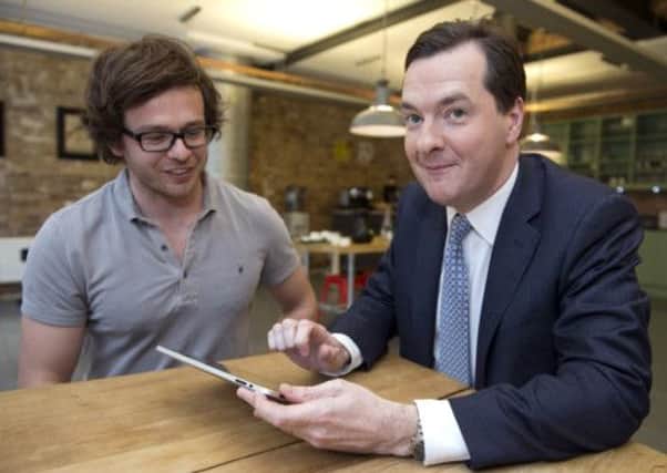 Chancellor George Osborne is shown how to play an internet security game called 'Capture' by the man who made it Howard Kingston