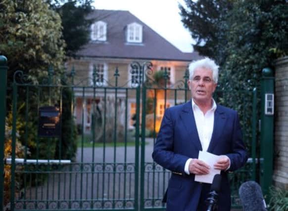 Max Clifford reads a statement to the media outside his home in Surrey