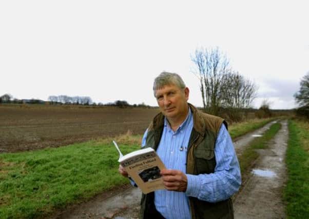 Historian Chas Jones walking along  the 'shield wall'  on the  battlefield of the Battle of Fulford