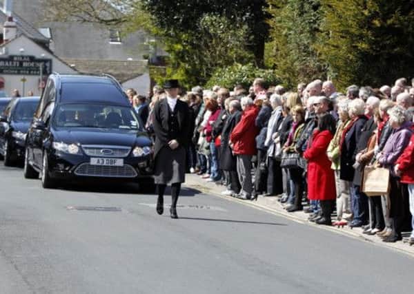 Crowds line the streets as the cortege arrives at Our Lady Of Compassion Church, Formby, Merseyside for the funeral of Hillsborough Campaigner Anne Williams. PIC: PA