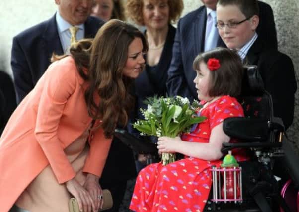The Duchess of Cambridge meets Sally Evans, eight, from Salisbury as she visits Naomi House Children's Hospice in Winchester, Hampshire, during Children's Hospice Week. PIC: PA