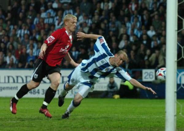 Andy Booth comes close to scoring past Bobby Hassall in 2006
