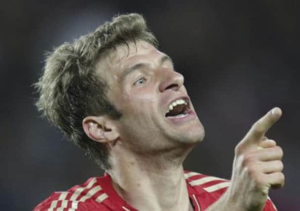 Bayern's Thomas Mueller celebrates after scoring