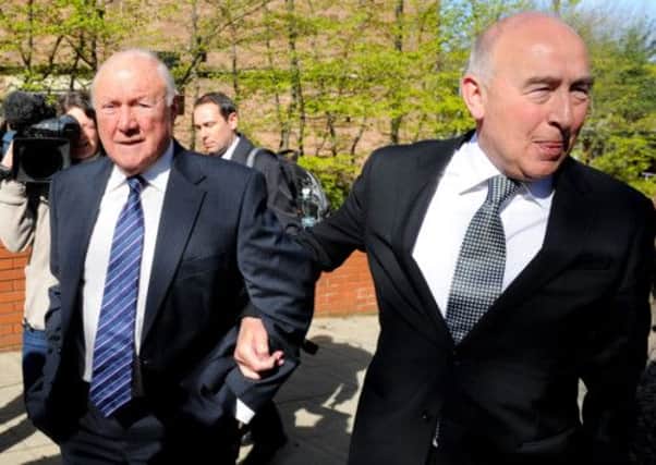 Stuart Hall (left) arrives at Preston Crown Court, with solicitor Maurice Watkins
