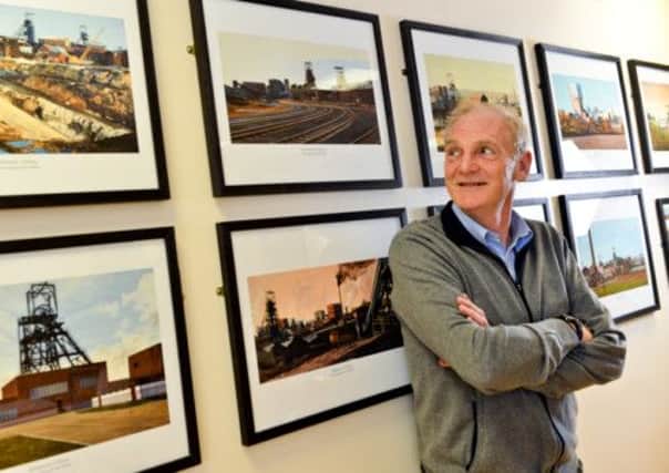 Artist Peter Watson reacquainted with colliery paintings. Picture by Simon Dewhurst
