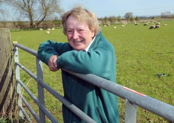 Margaret Wilkinson on farmland near her home