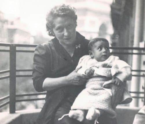 Fabian Hamilton's grandmother Louise Uziel with with an infant Fabian on her lap.