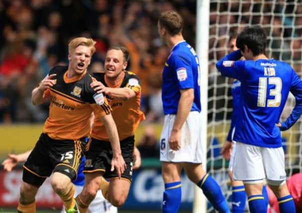 Hull City's Paul McShane celebrates scoring the second goal with team-mates David Meyler (right) and James Chester (left).