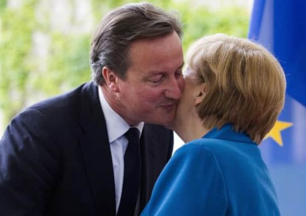 German Chancellor Angela Merkel welcomes Prime Minister David Cameron