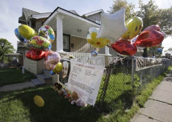 Balloons fly outside the home of Gina DeJesus