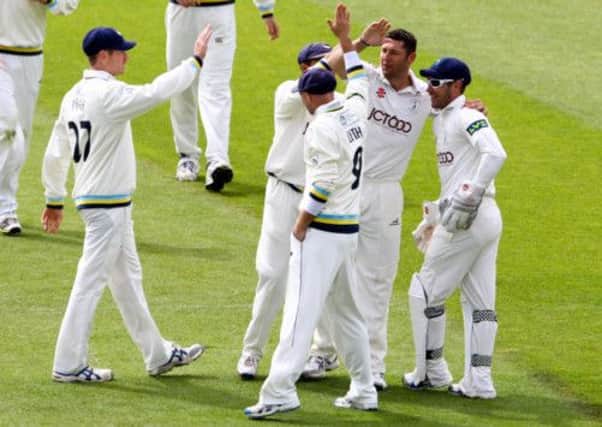 Yorkshire's Tim Bresnan (second right) is congratulated on the wicket of Somerset's Jack Leach.