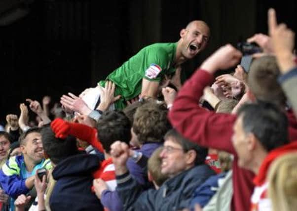 Doncaster Rovers Rob Jones celebrates winning League One