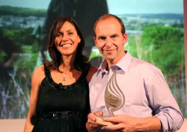 The 2011 awards: Host Julia Bradbury with Ian Butterfield of Forest of Bradford, winners of the Countryside award.