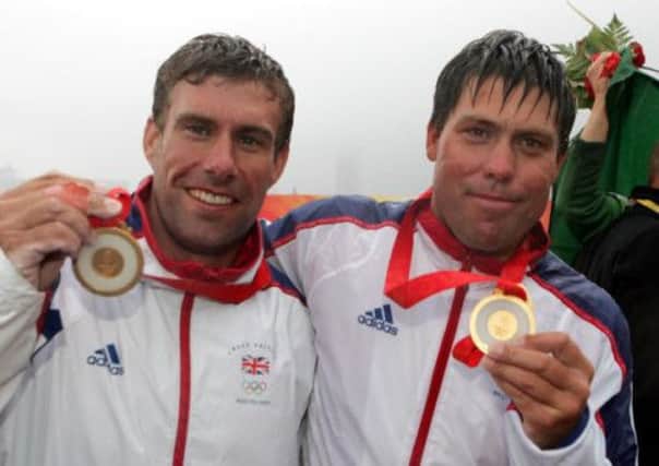 Andrew Simpson (right) and Iain Percy, celebrate after winning the Gold Medal in their class at the 2008 Beijing Olympic Games.