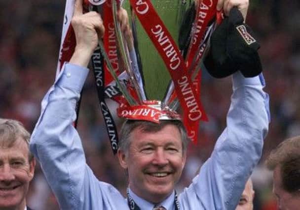 Alex Ferguson holds aloft the Premiership Trophy in 1999