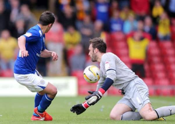 Watford goalkeeper Manuel Almunia saves a penalty rebound attempt from Leicester City's Anthony Knockaert