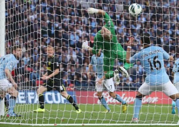 Wigan Athletic's Ben Watson (second left) scores the winning goal past Manchester City goalkeeper Joe Hart during the FA Cup Final at Wembley Stadium, London. (Picture: Dave Thompson/PA Wire).