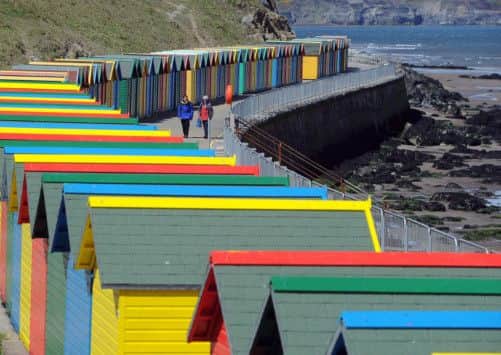 The landmark beach chalets on the West Cliff sea wall at Whitby. 
Picture by Gerard Binks