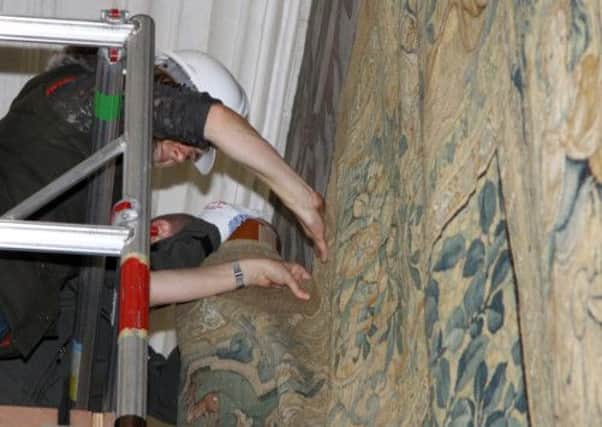 Workmen hang two Gideon Tapestries at Hardwick Hall