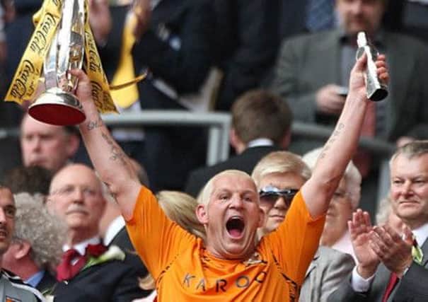 Dean Windass lifts the Championship play off trophy for Hull City in 2008