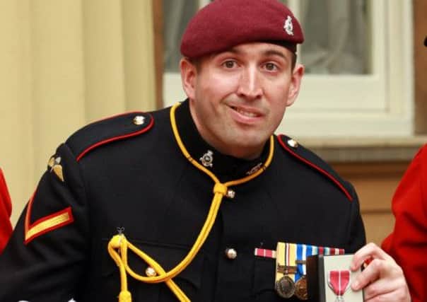 Lance Bombardier Benjamin Parkinson after receiving his MBE from the Prince of Wales.
