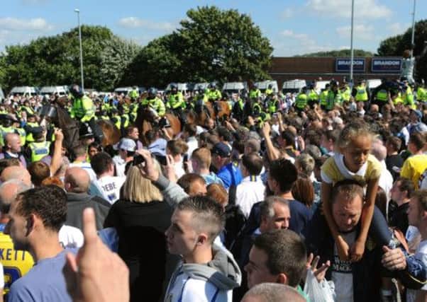 Leeds United fans outside Elland Road as police keep an eye on events.