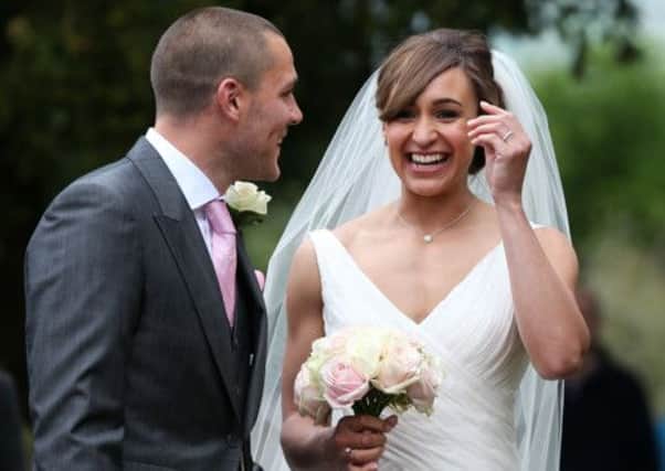 Olympic Gold medalist Jessica Ennis pose for the waiting media after she married Andy Hill in St Michael and All Angels Church, Hathersage, Derbyshire. (Picture: Lynne Cameron/PA Wire)