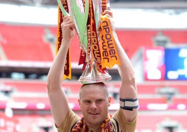 Gary Jones with the play-off trophy.