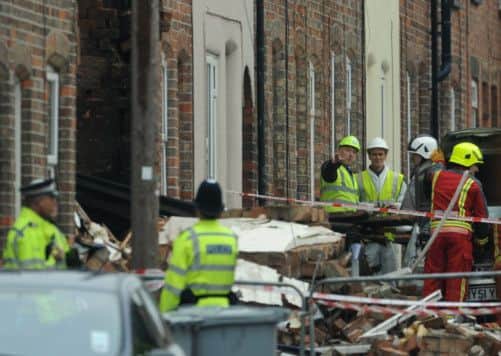 Emergency services outside the remains of a house in Wright Street, Newark that was destroyed in an explosion.