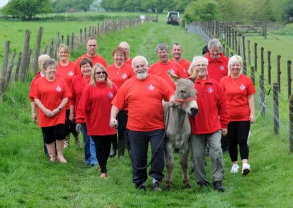 Lotto winners dig deep to help children in Leeds, the EST Donkey Sanctuary, Leeds.