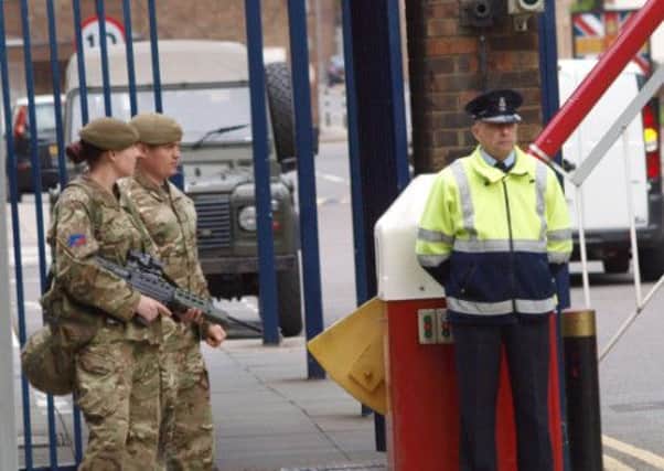 Armed servicemen outside The Royal Artillery Barracks in Woolwich