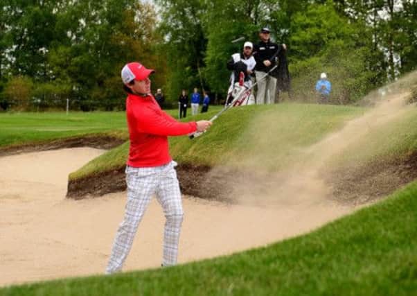 Northern Ireland's Rory McIlroy plays from the bunker during Round One of the BMW PGA Championship at the Wentworth Club
