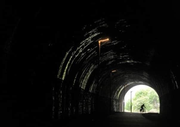 A cyclist enters the  reopened tunnel on the Dewsbury Ossett Greenway