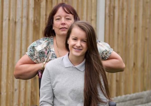 Hayley Davies, 15, suffers from an excruciating nerve disorder which renders her almost immobile. Picture: Ross Parry Agency
