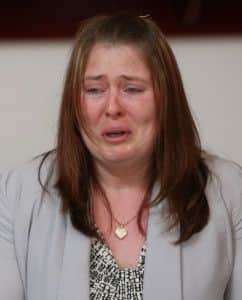 Rebecca Rigby, wife  of murdered soldier Lee Rigby, cries as a family statement is read to the media.