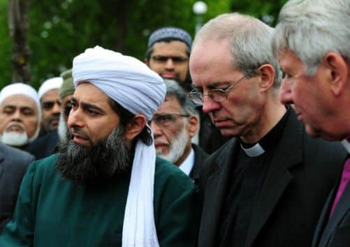 The Archbishop of Canterbury, the Most Reverend Justin Welby with the Assistant Secretary-General of the Muslim Council of Britain, Shaykh Ibrahim Mogra outside the Masjid Umar mosque, Leicester