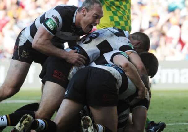 Hull FC's Chris Green scores the winning try
 and is mobbed.