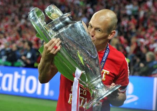 Bayern Munich's Arjen Robben kisses the UEFA Champions League trophy during the UEFA Champions League Final at Wembley Stadium, London. (Picture: Martin Rickett/PA Wire.)